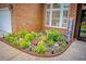 Beautifully landscaped front yard with a lush garden bed, perfect for adding curb appeal at 808 Long Drive Rd, Summerville, SC 29485