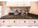 Kitchenette featuring white cabinets, granite countertops, and modern backsplash at 808 Long Drive Rd, Summerville, SC 29485