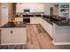Bright kitchen with white cabinets, dark granite, and hardwood floors at 808 Long Drive Rd, Summerville, SC 29485