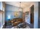Comfortable living room featuring stylish decor, modern lighting, and views to dining room at 808 Long Drive Rd, Summerville, SC 29485