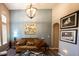 Cozy living room featuring a tan sofa, modern lighting, and stylish decor at 808 Long Drive Rd, Summerville, SC 29485