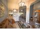 Inviting living room featuring hardwood floors, arched doorways, and seamless flow into other spaces at 808 Long Drive Rd, Summerville, SC 29485