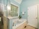 Bathroom featuring a tub with jets, a window, and a separate shower at 8316 Dye Makers, North Charleston, SC 29418