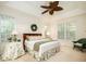 Bright bedroom with floral accents, ceiling fan and plenty of natural light at 8316 Dye Makers, North Charleston, SC 29418