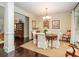 Cozy dining room with a wooden table, elegant chairs, chandelier, and warm neutral colors at 8316 Dye Makers, North Charleston, SC 29418