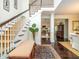 Grand foyer featuring a staircase, hardwood floors, and elegant decor with lots of natural light at 8316 Dye Makers, North Charleston, SC 29418