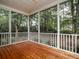 Inviting screened porch featuring wood flooring and backyard view at 8316 Dye Makers, North Charleston, SC 29418