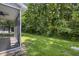 Relaxing screened porch and spacious backyard with lush trees, great for outdoor enjoyment at 8721 Grassy Oak Trl, North Charleston, SC 29420