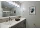Modern bathroom featuring a double sink vanity, updated lighting, and a framed mirror at 8721 Grassy Oak Trl, North Charleston, SC 29420