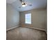 Bedroom with neutral carpet, walls, and ceiling fan with lots of natural light at 8721 Grassy Oak Trl, North Charleston, SC 29420