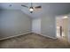 Bedroom with neutral carpet, ceiling fan, and closet, bathed in natural light at 8721 Grassy Oak Trl, North Charleston, SC 29420