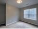 This bedroom features plush carpeting, a large window and fresh neutral paint at 8721 Grassy Oak Trl, North Charleston, SC 29420