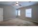 Bedroom with vaulted ceiling, neutral walls, carpet and natural light from windows at 8721 Grassy Oak Trl, North Charleston, SC 29420