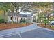 A beautiful community clubhouse nestled among lush greenery, offering a welcoming space for residents at 8721 Grassy Oak Trl, North Charleston, SC 29420