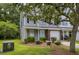Inviting townhome with a well-manicured lawn and lush landscaping that creates an inviting outdoor space at 8721 Grassy Oak Trl, North Charleston, SC 29420