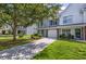 Charming townhome with well-maintained front yard and inviting curb appeal with attractive landscaping at 8721 Grassy Oak Trl, North Charleston, SC 29420