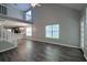 Inviting living room featuring tall ceilings, laminate floors, and an adjacent kitchen area at 8721 Grassy Oak Trl, North Charleston, SC 29420