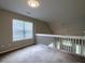 Inviting loft space offers versatility, with natural light streaming through a window and a view of the floor below at 8721 Grassy Oak Trl, North Charleston, SC 29420