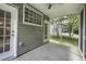 Outdoor screened porch with view of backyard at 8721 Grassy Oak Trl, North Charleston, SC 29420