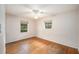 Bedroom featuring hardwood floors, two windows and a ceiling fan at 943 Mikell Dr, Charleston, SC 29412