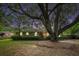 Charming brick home with a mature tree, manicured lawn and inviting curb appeal at 943 Mikell Dr, Charleston, SC 29412