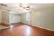 Spacious living room with hardwood floors, natural light, ceiling fan, and back door at 943 Mikell Dr, Charleston, SC 29412