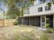 View of the fenced in backyard with access to the screened porch at 10 Stallion Ct, Charleston, SC 29407