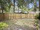 Fenced backyard with gate and mature trees at 10 Stallion Ct, Charleston, SC 29407
