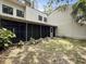 Backyard with lush green foliage and partial view of the property at 10 Stallion Ct, Charleston, SC 29407