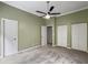 Bedroom featuring gray carpet, closet doors and fan at 10 Stallion Ct, Charleston, SC 29407