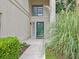 Inviting front entrance features a decorative green door, greenery, and a pathway to the home at 10 Stallion Ct, Charleston, SC 29407