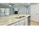 Bright kitchen featuring white cabinets, stainless steel appliances, and stone countertops at 10 Stallion Ct, Charleston, SC 29407