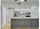 Charming kitchen featuring gray cabinets, stainless steel appliances, and bright, open layout at 10 Stallion Ct, Charleston, SC 29407