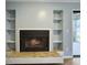 Cozy living room with a fireplace and built-in shelving at 10 Stallion Ct, Charleston, SC 29407