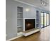 Bright living room featuring fireplace and built in shelves at 10 Stallion Ct, Charleston, SC 29407