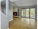 Bright living room featuring a modern fireplace, shelving, and large sliding glass doors to the patio at 10 Stallion Ct, Charleston, SC 29407