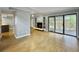 Bright living room featuring a modern fireplace, shelving, and large sliding glass doors to the patio at 10 Stallion Ct, Charleston, SC 29407
