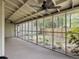 View of the screened in porch with ceiling fan and view of the backyard at 10 Stallion Ct, Charleston, SC 29407