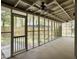 View of the screened in porch with ceiling fan and view of the backyard at 10 Stallion Ct, Charleston, SC 29407