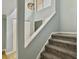 Carpeted stairway with neutral walls and modern lighting at 10 Stallion Ct, Charleston, SC 29407