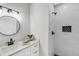 Modern bathroom featuring a tiled shower with a rainfall shower head and sleek black fixtures at 101 Hanover St, Charleston, SC 29403