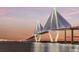 Scenic view of the Arthur Ravenel Jr. Bridge over water at sunset with city skyline in the background at 101 Hanover St, Charleston, SC 29403