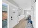 Bright entryway with hardwood floors, leading into a dining area and featuring a glass paneled door at 101 Hanover St, Charleston, SC 29403
