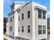Charming home showcasing light-colored siding and contrasting trim under a bright blue sky at 101 Hanover St, Charleston, SC 29403
