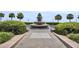 Beautiful Pineapple Fountain surrounded by lush greenery and palm trees in a serene outdoor setting at 101 Hanover St, Charleston, SC 29403