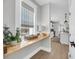 Bright hallway with wood floors and a view of the kitchen and window at 101 Hanover St, Charleston, SC 29403