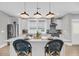Modern kitchen with a spacious island, stainless steel appliances, and ample natural light at 101 Hanover St, Charleston, SC 29403