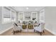 Bright living room featuring large windows, neutral decor, and stylish furniture at 101 Hanover St, Charleston, SC 29403