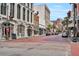 Vibrant street scene with historic buildings, pedestrian activity, and a blend of retail and commercial spaces at 101 Hanover St, Charleston, SC 29403