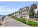 Picturesque waterfront featuring a row of beautiful homes, palm trees, and manicured landscaping at 101 Hanover St, Charleston, SC 29403